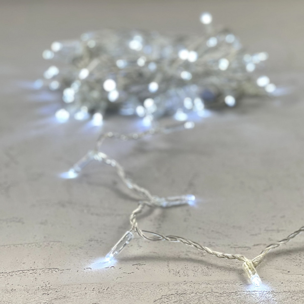 Светодиодная гирлянда с колпачком 100 холодных белых LED ламп 10 м., мерцание, 24В., прозрачный провод ПВХ, IP65, LTC (PST100BLWCAP-10-1W)